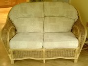 2 x Two Seater Cane Settee's c/w cream pastel cushons